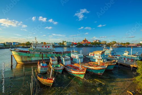 Fishing port and beautiful sky in Asia,Many boats moored in sunrise morning time at Chalong port, Main port for travel ship to krabi and phi phi island, Phuket, Thailand