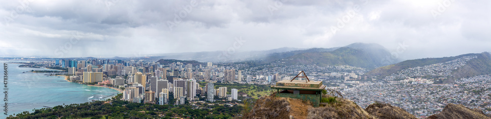 Aerial view of Honolulu, ocean, and foggy mountains from the summit of Diamond Head crater in Oahu, Hawaii Aerial view of Honolulu, ocean, and foggy mountains from the summit of Diamond Head crater in Oahu, Hawaii