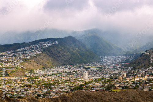 Aerial view of Honolulu, ocean, and foggy mountains from the summit of Diamond Head crater in Oahu, Hawaii