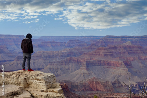 tourist enjoying the view from canyon edge