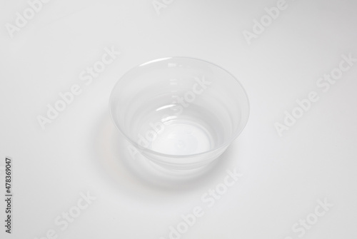 Glassware. Crystal transparent utensils. Fruit bowl. vase, glass plate for dessert, serving tea isolated on gray background.High resolution photo.Top view. Mock-up.