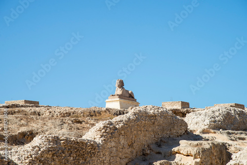 View of Pompey's Column with blue sky in the Serapeum of Alexandria, Egypt photo