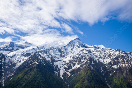 Snow-capped Mont Blanc and Aiguille du Gouter in Europe  France  the Alps  towards Chamonix  in summer  on a sunny day.