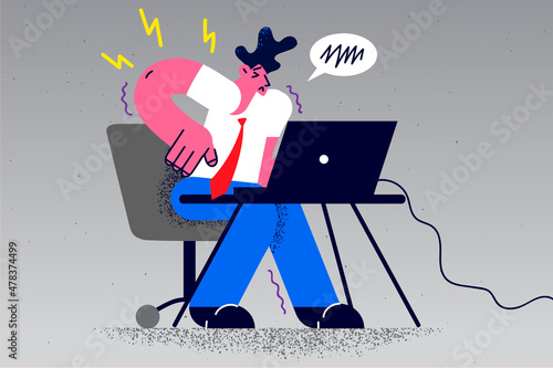 Unhealthy businessman suffer from backache from sedentary work 
