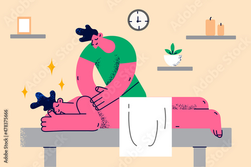 Professional masseur give massage to client in saloon 