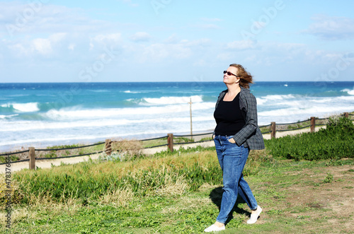 Portrait of happy and real 45 years old woman at seashore © dubova