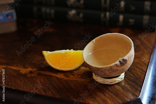 mezcal gourd on a wooden surface photo