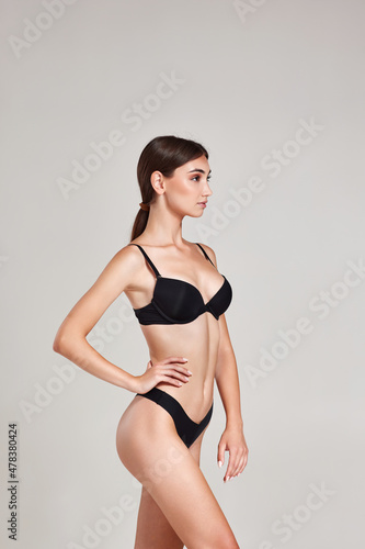 gorgeous slim woman with perfect body in black underwear