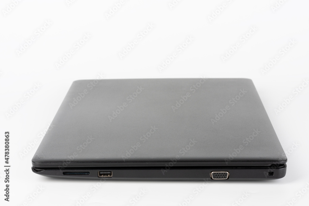 Modern, new office black laptop on white background, side view. USB 2.0 port, vga port. Modern, new office black laptop on white background, side view. USB 2.0 port, vga port.