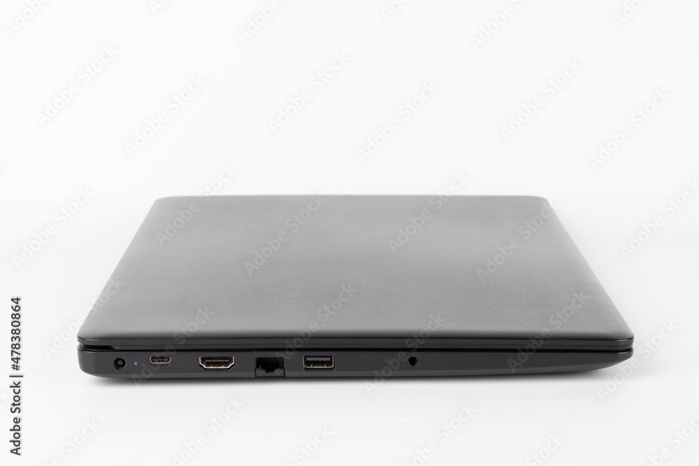 Modern, new office black laptop on white background, side view. USB 2.0 port, RJ-45, HDMI port. Modern, new office black laptop on white background, side view. USB 2.0 port, RJ-45, HDMI port.