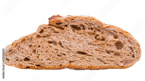 A piece of dark rye whole grain wholesome bread isolated on a white background. Healthy food.