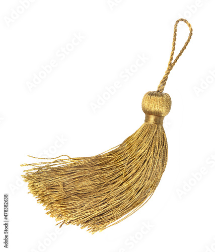 Golden silk tassel isolated on white background for creating graphic concepts photo