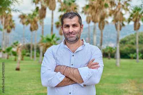 Outdoor portrait of mature confident man looking at camera