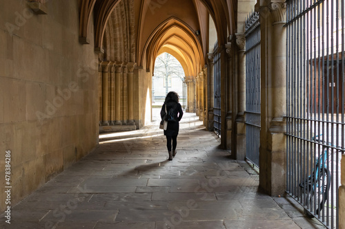 Woman walks on church porches-Pamplona