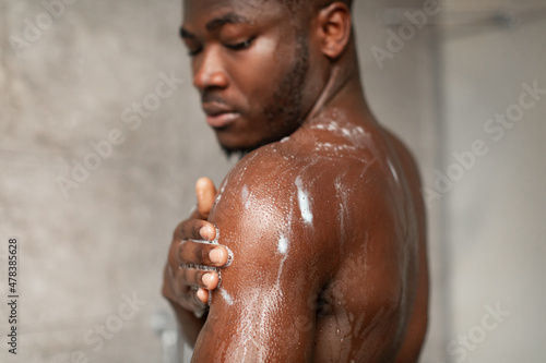 Muscular African American Man Washing Body Taking Shower Indoors
