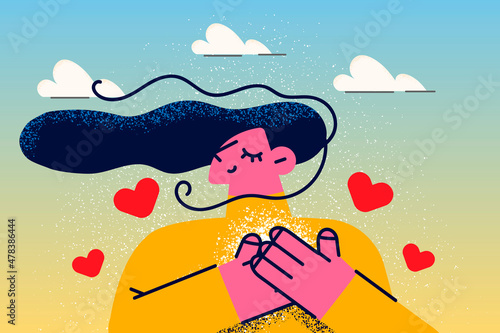 Happy woman with hands at heart feel grateful 