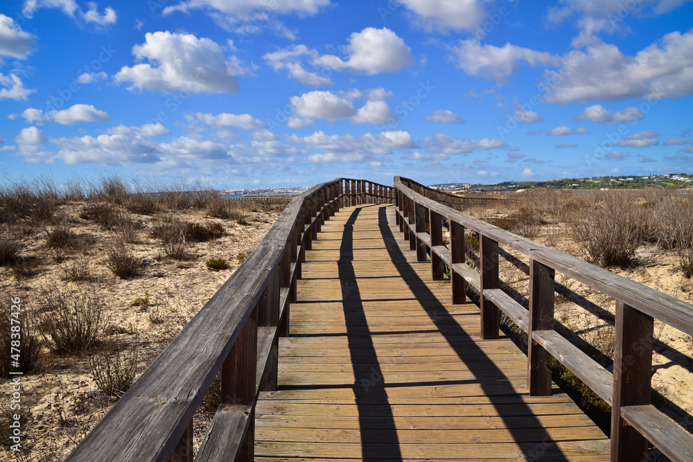 Wooden boardwalk crossing marshes, Alvor, Algarve, Portugal