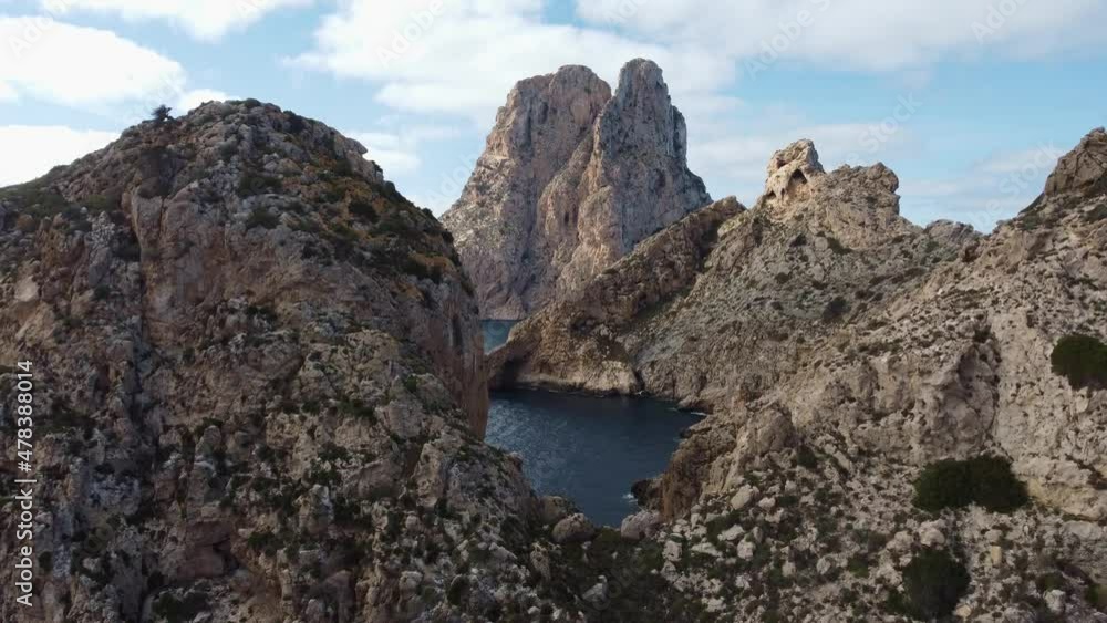 The iconic islands Es Vedra and Es Vedranell, on the west coast of Ibiza. Video recorded with drone. The iconic islands Es Vedra and Es Vedranell, on the west coast of Ibiza. Video recorded with drone.