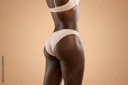 Foto Beautiful buttocks of unrecognizable black woman, cropped