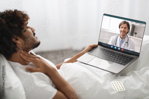 Sick hindu guy having video chat with his doctor
