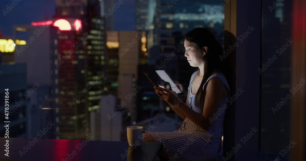 Woman look at the tablet computer at night Woman look at the tablet computer at night