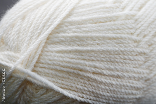 White threads of natural wool close-up in full screen