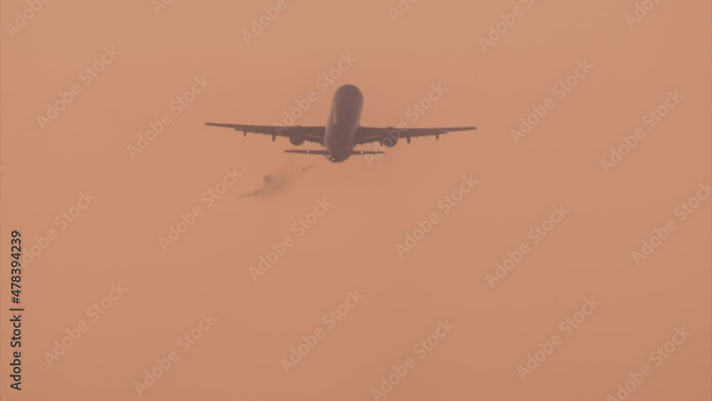 Big passenger airliners fly within sunset sky. Scenic vista of the huge aircraft departed from the airport towards golden hour skyline as seen from below. High quality 4k footage Big passenger airliners fly within sunset sky. Scenic vista of the huge aircraft departed from the airport towards golden hour skyline as seen from below. High quality 4k footage