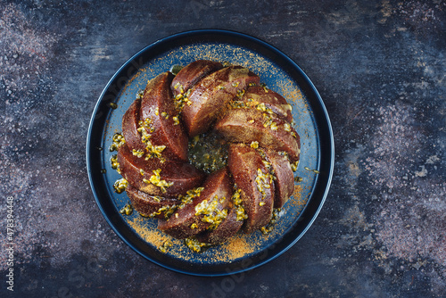Photography Exotically bundt marble passion fruit rum cake with icing sugar glaze, fresh fru