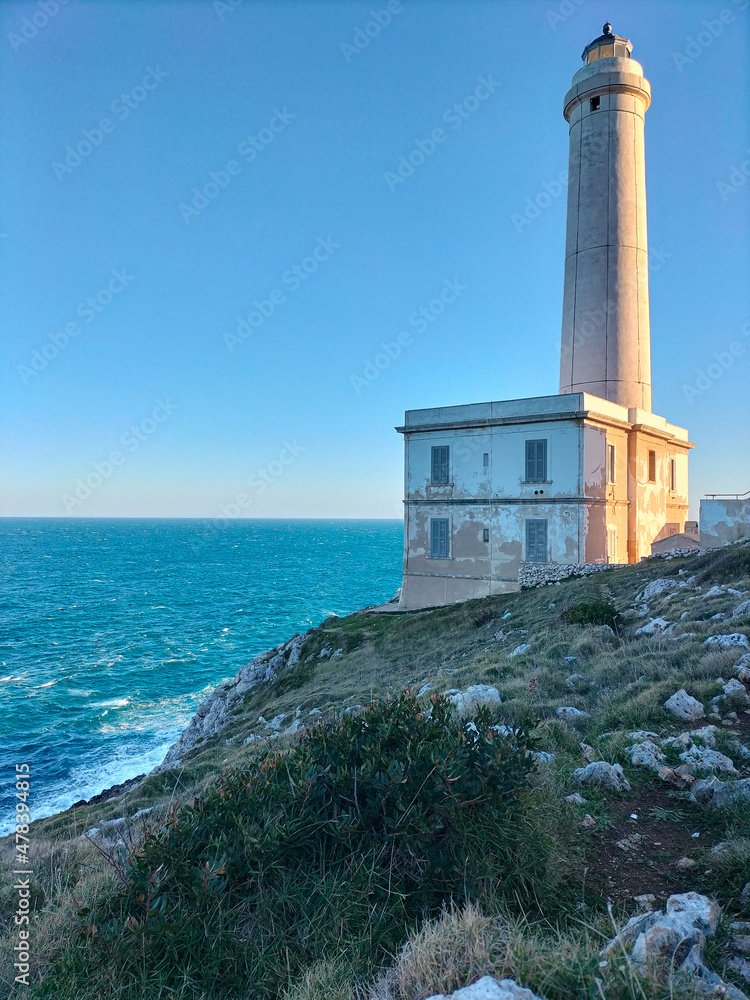 Punta Palascia lighthouse, Otranto, Lecce, Salento, Apulia. Surrounded by Mediterranean maquis it stands on a promontory in a natural park over the adriatic sea waves. The most eastern point of Italy
