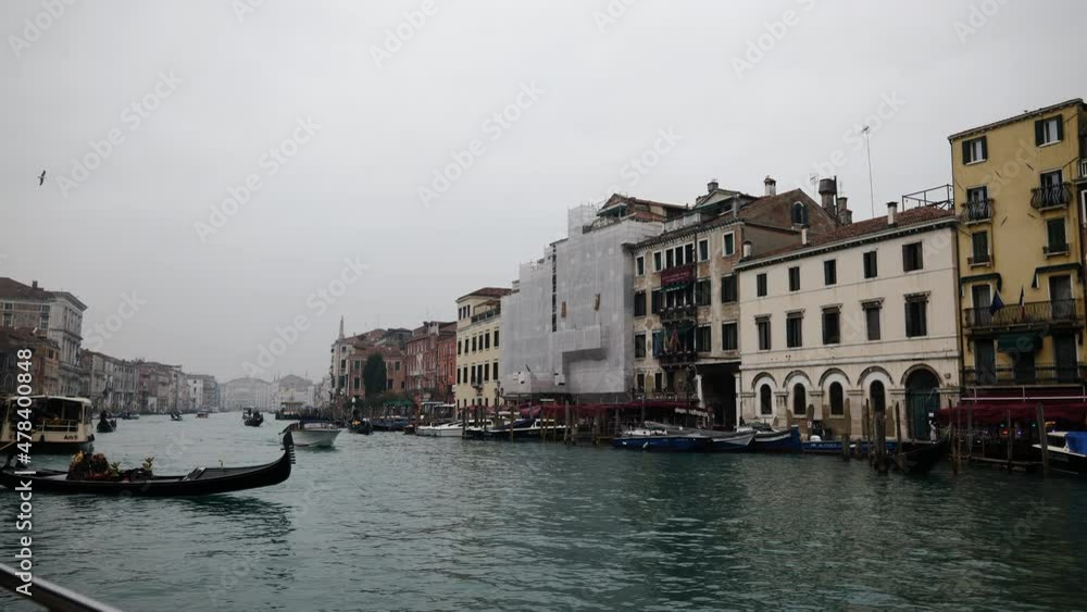Venice, Italy - January 2022 - Traveling on the public transport boat, along the Grand canal, among the splendid historic buildings of the lagoon city Venice, Italy - January 2022 - Traveling on the public transport boat, along the Grand canal, among the splendid historic buildings of the lagoon city