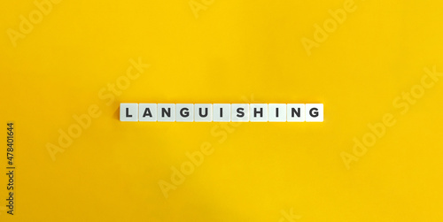 Languishing banner and word. Block letters on bright orange background.