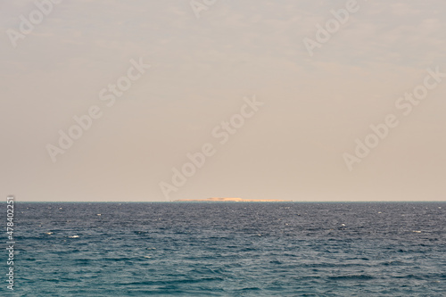 The surface of the water of the Red Sea with a horizon in the background.