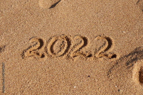 Inscription 2022 on the sand on the shores of the Red Sea. photo