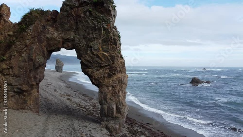 cape with rocks on the ocean shore photo