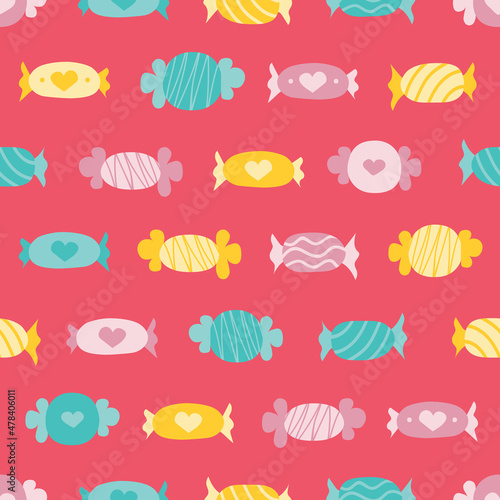Pink  yellow and turquoise seamless pattern candies over pink background