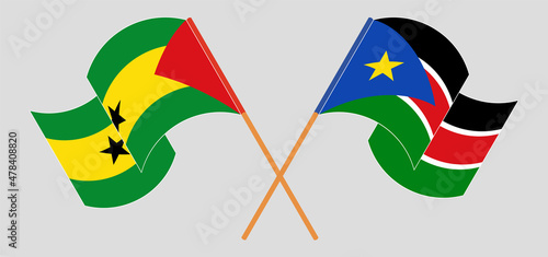 Crossed and waving flags of Sao Tome and Principe and South Sudan