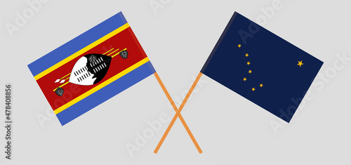 Crossed flags of Eswatini and the State of Alaska. Official colors. Correct proportion. Vector illustration