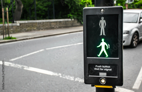 Push the button wait for signal. Pedestrians safety concept.
