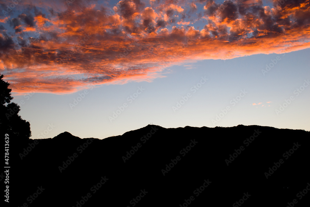 Evening time landscape of mountain and pink red dark sky