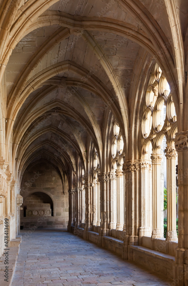 Arched gallery in the monastery of Santa Maria de Santes Creus (Aiguamurcia). Catalonia, Spain