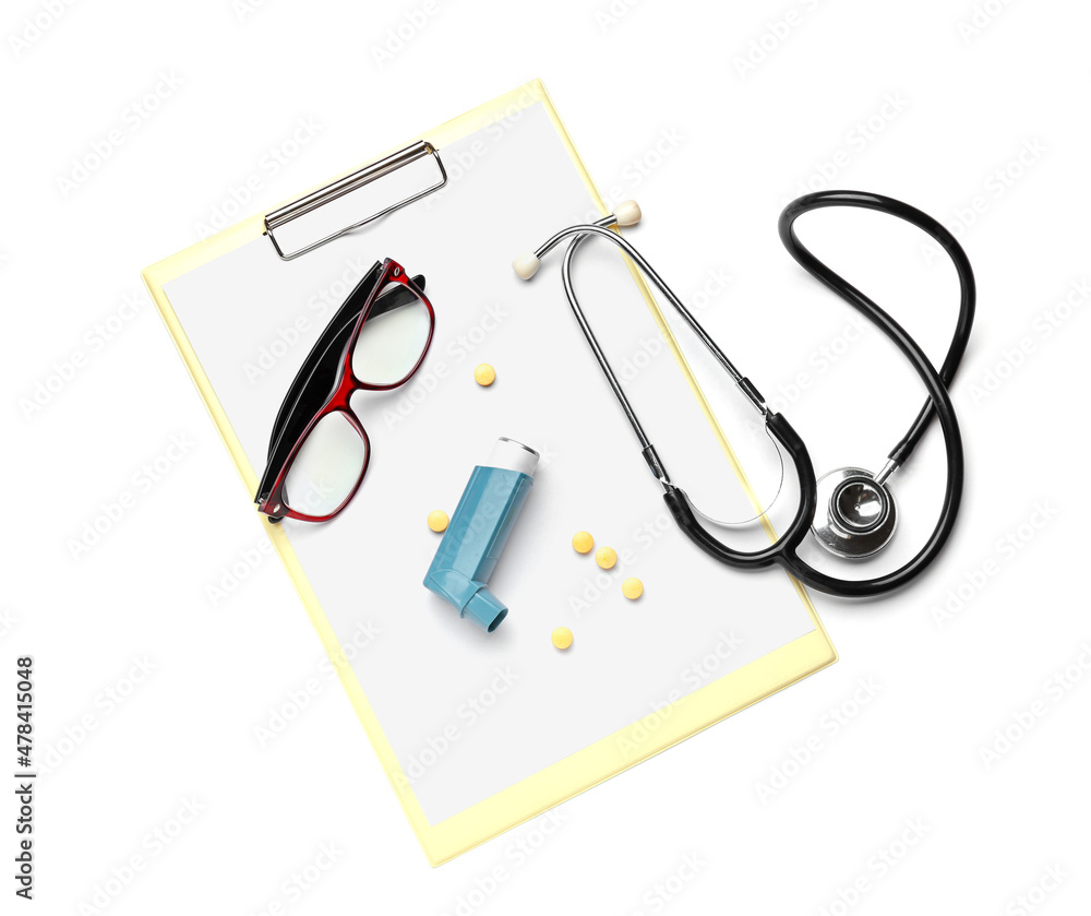 Asthma inhaler, pills, eyeglasses, stethoscope and clipboard on white background Asthma inhaler, pills, eyeglasses, stethoscope and clipboard on white background