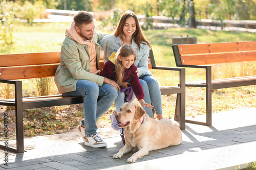 Happy family with Labrador ...
