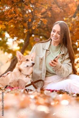 Young woman with mobile pho...