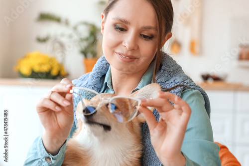 Young woman with cute Corgi...