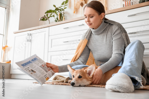 Young woman with cute Corgi...