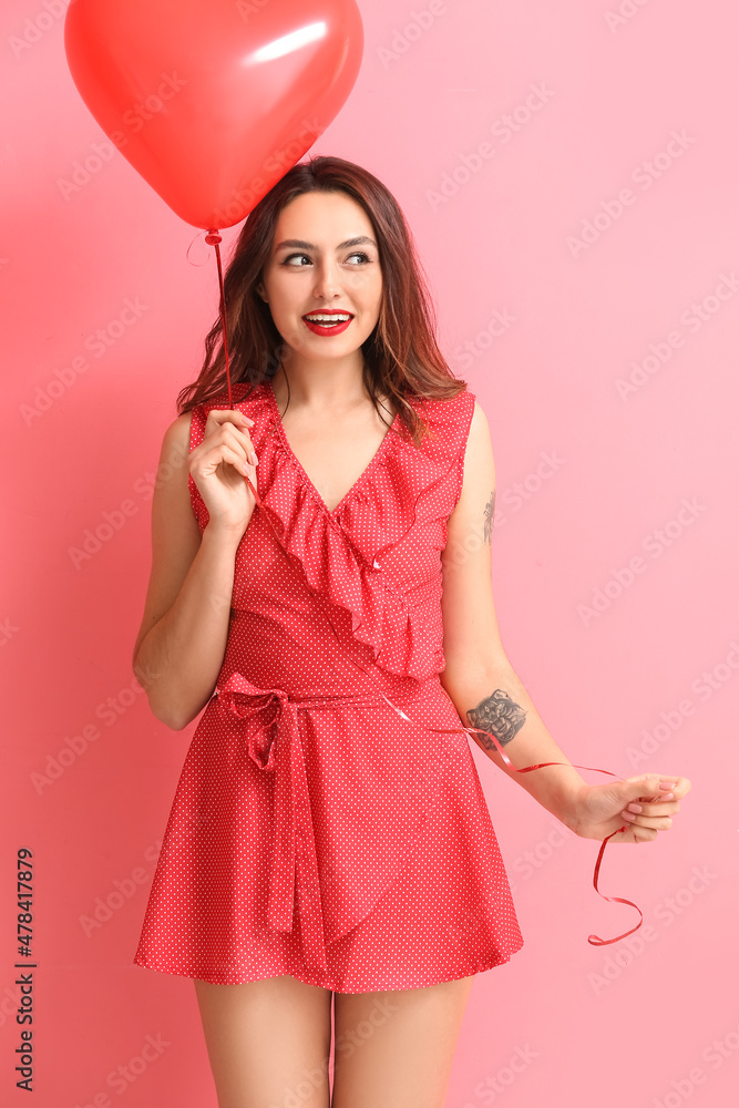 Beautiful young woman with balloon on color background. Valentine's Day celebration Beautiful young woman with balloon on color background. Valentine's Day celebration
