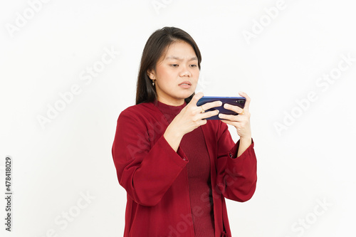 Playing Mobile Game on Smartphone of Beautiful Asian Woman Wearing Red Shirt Isolated On White