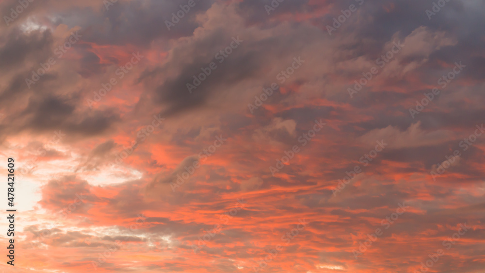 sunset with clouds in the orange sky