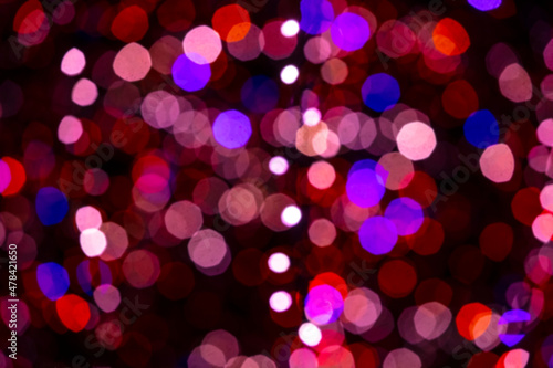 Holiday lights in out of focus. Christmas lights. Holiday background. Winter illuminations.