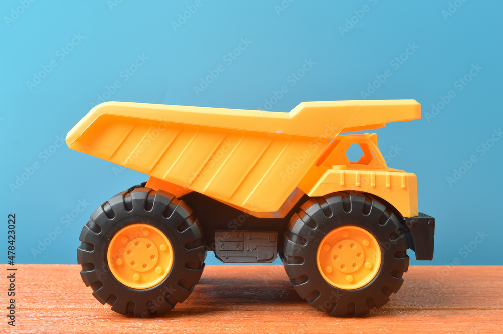 View of dump truck toy construction vehicle View of dump truck toy construction vehicle